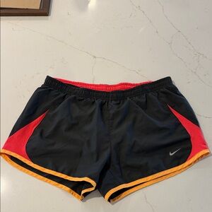 Nike Women’s Black Athletic Shorts with Red Panels and Yellow Trim
